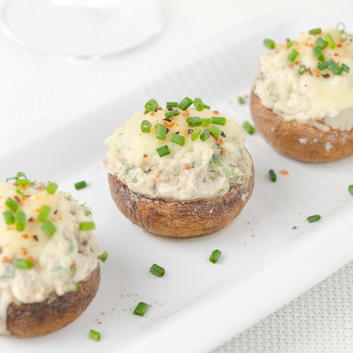 Stuffed mushrooms, baked with cheese and herbs,