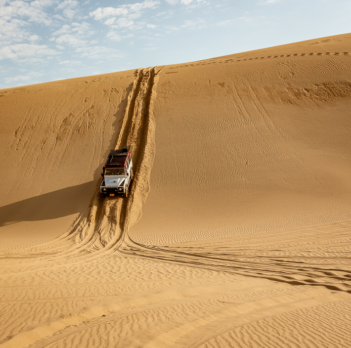 Sand Dune 4-wheeling - truck on sand